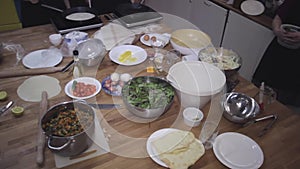 People serving food ingridients at workshop