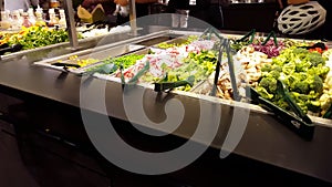 People serving fresh food at salad bar 4k