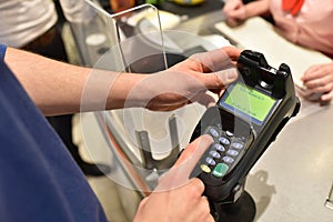 People shopping for food in the supermarket - checkout paying