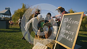 People shopping at local farmers market