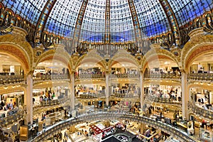 People shopping in luxury Lafayette department store of Paris, France