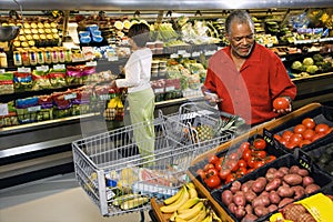 People shopping for produce.