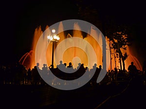 People silhouette magic fountain barcelona spain