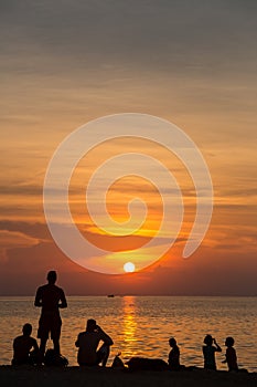 people silhouette at sunset beach thailand