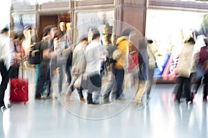 People silhouettes in motion blur, airport interior