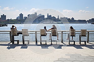 People sit on chairs and admire views of the photo