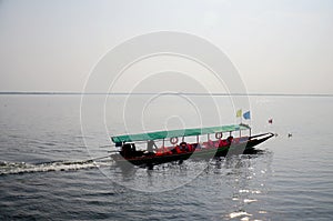 People sit and drive long tail boat go to Donsawan island