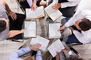 People Sitting In A Circle Reading Bible