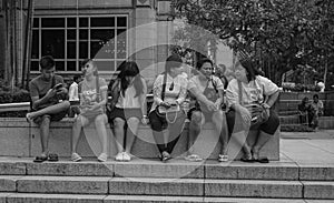 People sitting at the city park in Kuala Lumpur, Malaysia