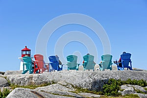 People sitting in seats to view Peggy`s Cove, Nova Scotia photo