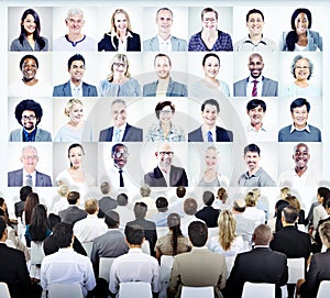 People Sitting with Set of Business People's Faces