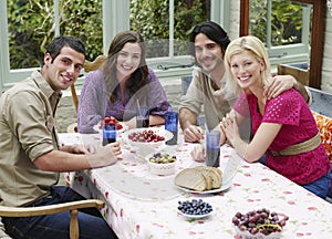 People Sitting At Verandah Table