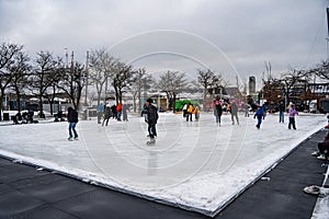 People skating at the Harbourfront Centre ice rink in Toronto.