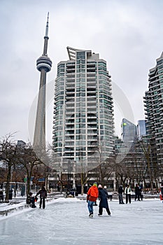 People skating at the Harbourfront Centre ice rink in Toronto.
