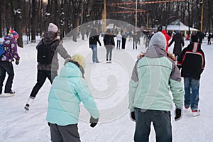 People on skating rink in park