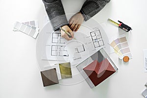 People sketching house plan blueprint photo