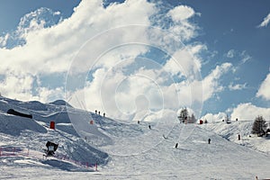 People skiing down a French Alps slope