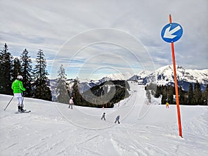 People skiing down a ski slope