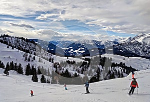 People skiing down a ski slope