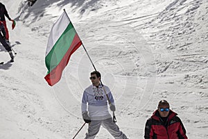 People skiing dressed with traditional bulgarian clothes.