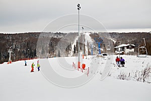 People skiing and snowboarding at winter ski