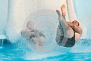 People sliding at water park