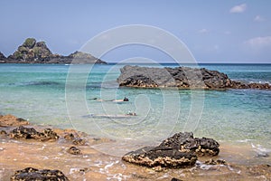 People Snorkeling at Praia do Sancho Beach - Fernando de Noronha, Pernambuco, Brazil