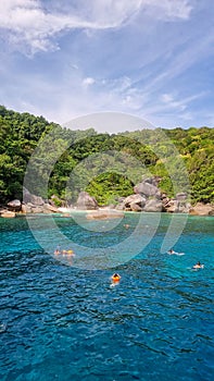 people snorkling in the ocean of Similan Islands Thailand Phangnga