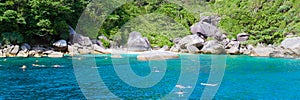 people snorkling in the ocean of Similan Islands Thailand Phangnga