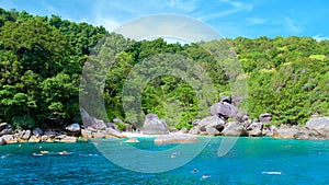 people snorkling in the ocean of Similan Islands Thailand Phangnga