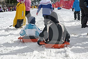 Wintertime: time to have fun in a ski resort. Snow, mountain, tobogganing. photo