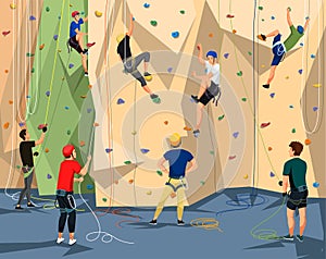 People in sportswear training on climbing wall