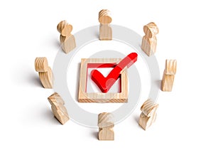 People stand in a circle and look at the check mark in the box. election, poll or referendum. Voters participate in elections