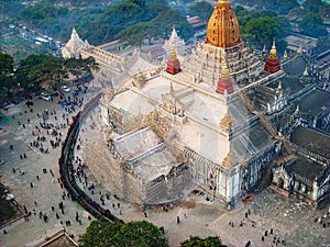 people stand in line at a temple