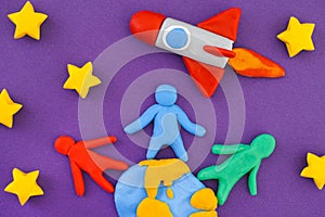 People standing on Earth and launching space rocket into space