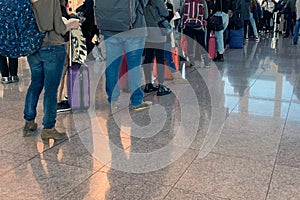 People standing in line at the airport on board the aircraft