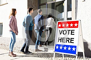 People Standing Outside Voting Room