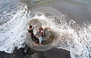 People standing on the rocks in Bali, Indonesia