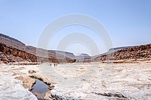 People on the stone river, Draa valley (Morocco)