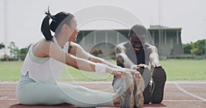 People, stretching and fitness in running, exercise or getting for sports marathon on outdoor stadium track. Man, woman