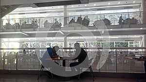 People studying at a local library