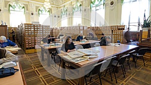 People studying in the reading room of national library