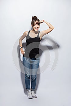 People, style and fashion concept - happy young woman or teen girl in casual clothes having fun.