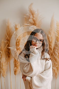 people, style and fashion concept - happy young woman or teen girl in casual clothes and hipster hat.