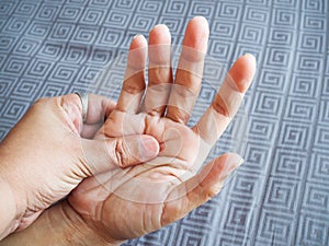 People suffering with hand pain and palms, beriberi symptom on hand nerves or inflammation of the muscles from work