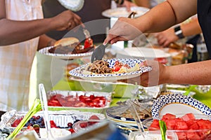 People at a Summer Potluck Barbecue