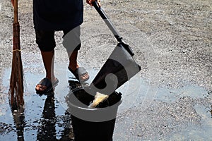 People are sweeping dirty water at ground streets, cleaner floor, housemaid, housekeeper, homemaker, maidservant, maid photo