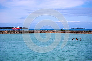 People swimming near port, Tonga