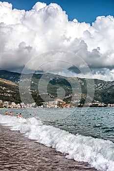 People swimming in the sea at resort Becici in Montenegro