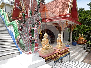 People take off their shoes before entering the temple of the big Buddha, Samui, Thailand, December